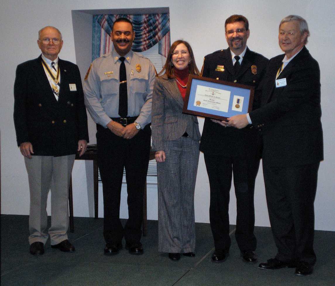 Cantor Shochet's Award Presentation Pictured left to right: Dennis Hickey, Captain Bruce Ferguson, Denise Shochet, Michael Shochet, and President Tom Speelman