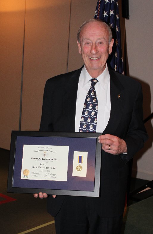 Bob Rosenbaum with his framed Citizen of the Year certificate and medal