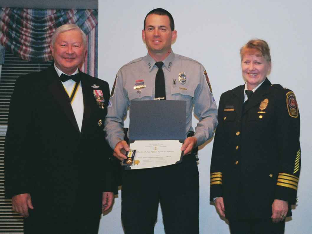 MPO Kevin Palizzi receiving the Law Enforcement Commendation award from Chapter President Tom Speelman.