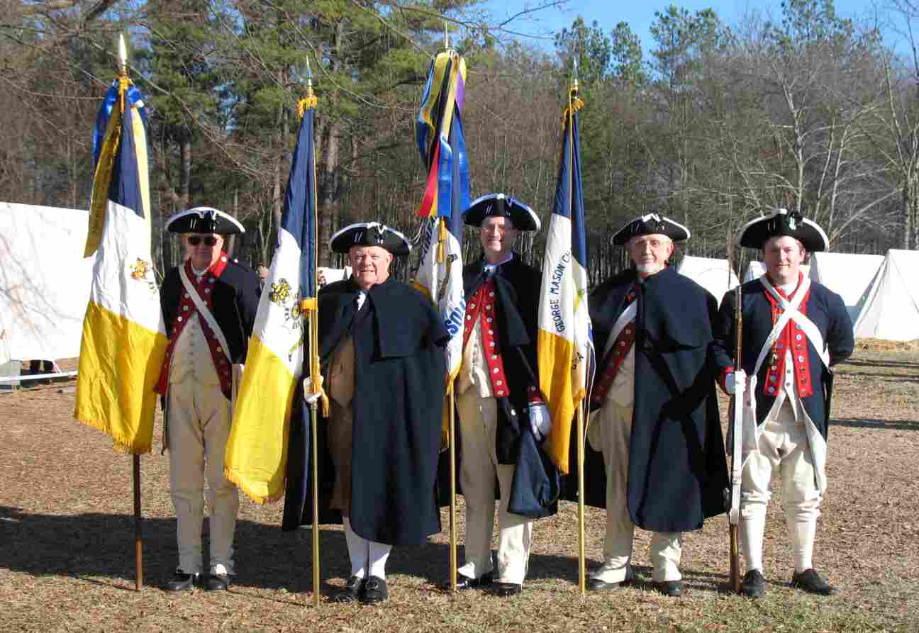 The VASSAR Colorguard at Cowpens: Dennis Fritts with the Fincastle Resolutions Chapter Flag, Larry McKinley with the VASSAR Colorguard Flag, Darrin Schmidt with the Fairfax Resolves Chapter Flag, Capt. Andrew Johnson with the George Mason Chapter Flag, and Dan Rolph with a Brown Bess reproduction musket.
