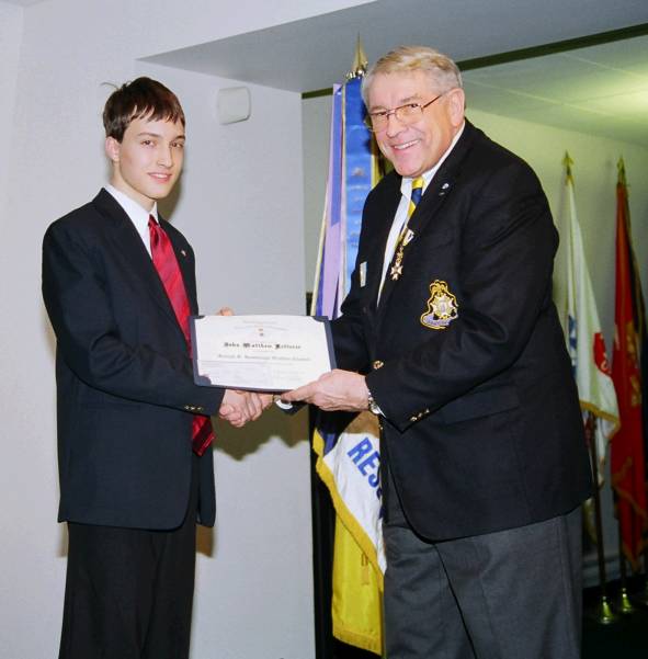 Chapter Oration winner Matthew Retterer recieves his certificate from Second Vice President John Jack Sweeney.