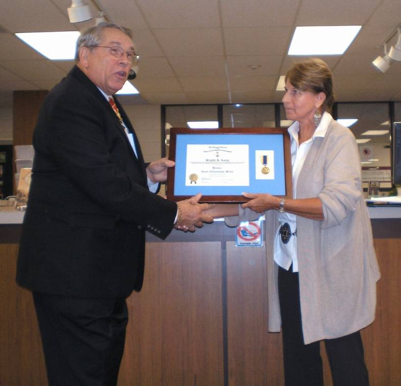 In the attached photo, Fairfax Resolves Chapter President, Jack Sweeney, presents Ms. Lavey with a professionaly framed Bronze Citizenship Medal Certificate and mounted medal.