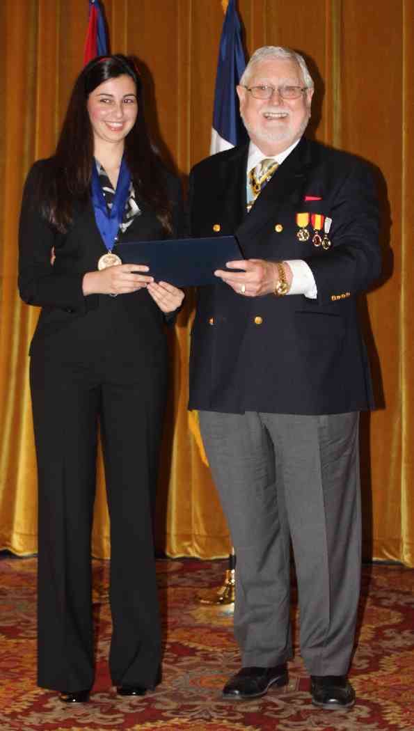 President General Ed Butler presents Kristi with a medal, certificate, and most importantly, a check for $3000.