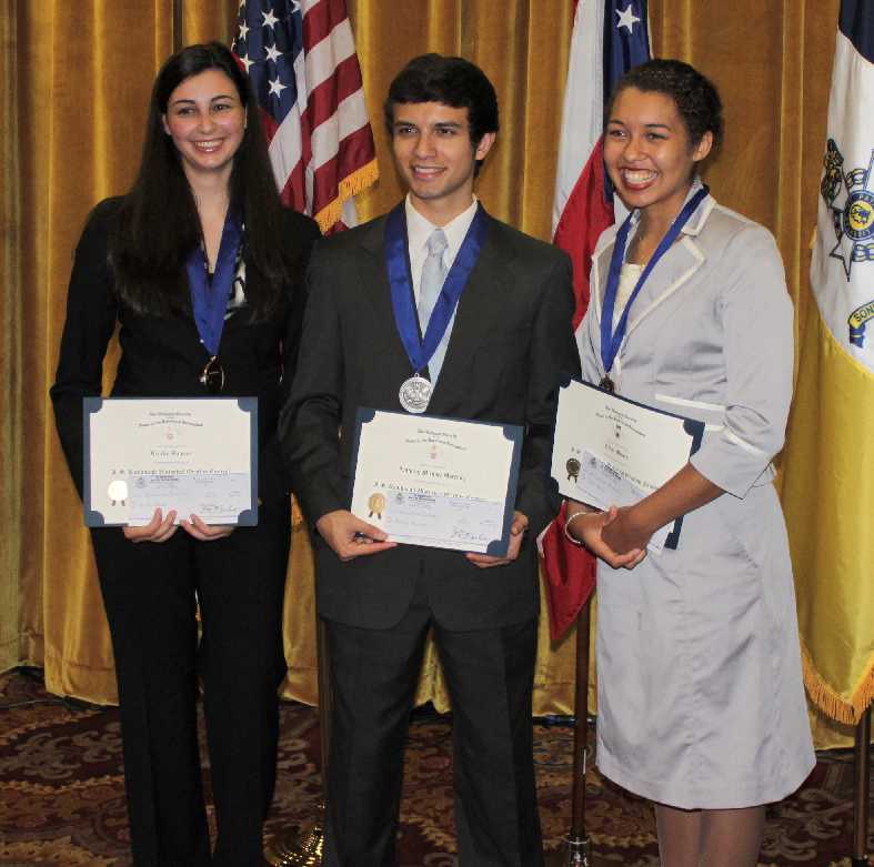 Kristi stands with the second and third place winners.