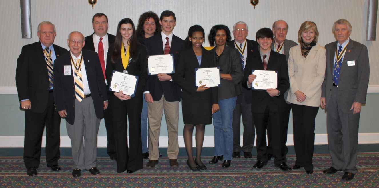 The first place winner, Kristi Bowers, participates in the group shot that includes the rest of the contestants, parents of the contestants, and the Chapter sponsors.