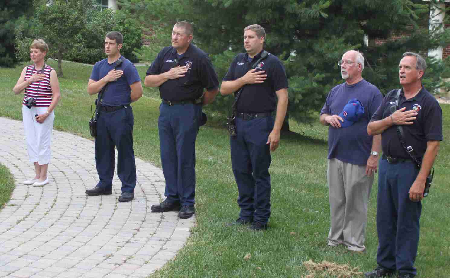 Members of the Great Falls Fire Dept. and Friends of the Great Falls Freedom Memorial recite the Pledge of Allegiance.