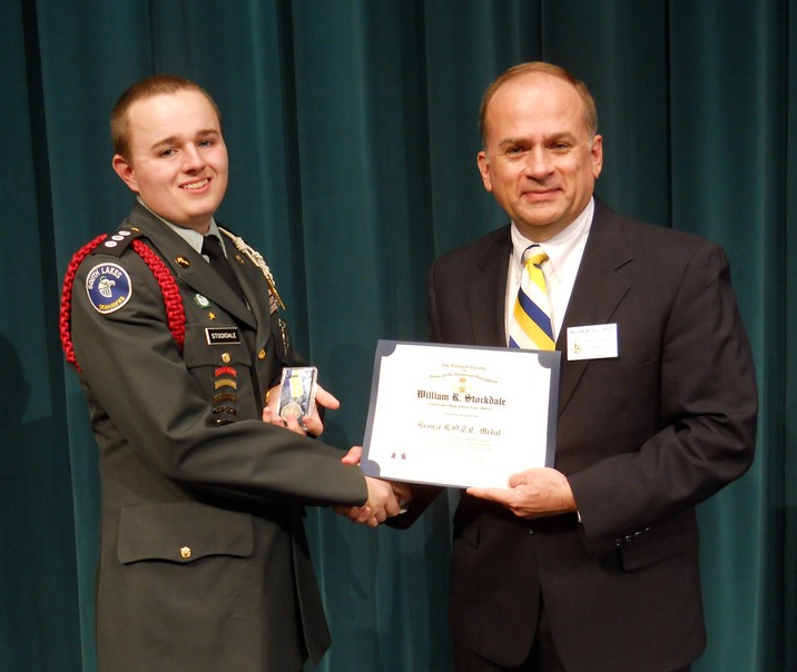 Compatriot Bill Price presents the SAR JROTC Medal to Cadet William Stockdale at South Lakes High School on 9 May, 2011.