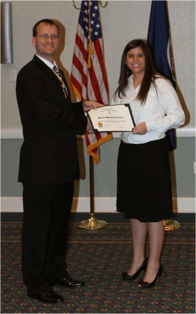 Darrin Schmidt presents the winner Yvonne Bowser-Caballero with a certificate and check.