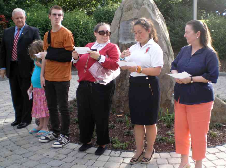 Compatriot Larry McKinley and members of the C.A.R. and their parents conduct the ceremony before retiring the flags.