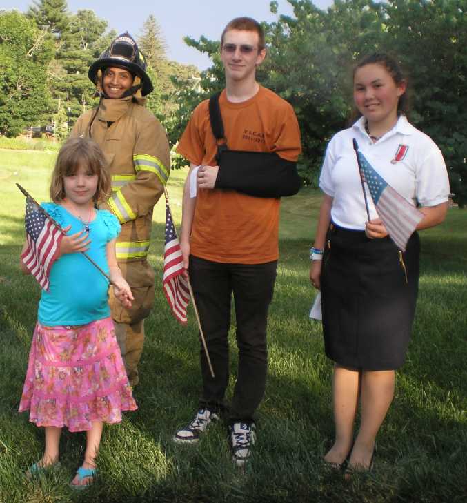 The C.A.R. participants with a Great Falls Volunteer Firefighter who participated in the flag retirement ceremony.