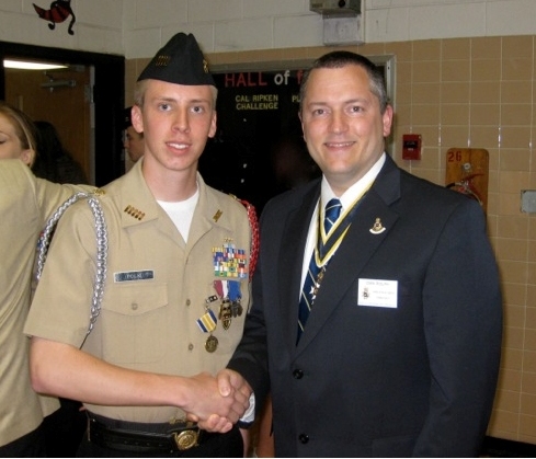 Compatriot Dan Rolph presents the SAR JROTC Medal to Cadet Alexander Polk at Herndon High School on 18 May, 2012.