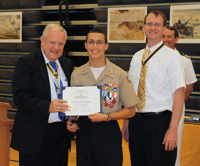 Compatriots Larry Mckinley and Darrin Schmidt present the SAR JROTC Medal to Cadet Timothy Kaufman at Loudoun High School on 31 May, 2012.
