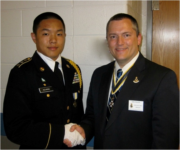 Compatriot Dan Rolph presents the SAR JROTC Medal to Cadet Timothy Kim at South Lakes High School on 22 May, 2012.