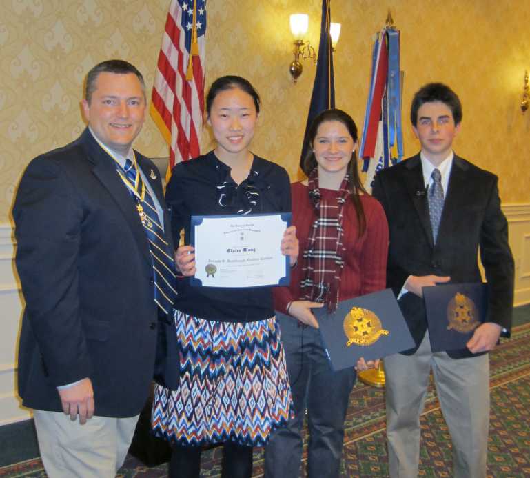 President Dan with left, Clare Wang, Trinity Christian School; runner up Annmarie Baxter, and third place Forbes McKay, Bishop OConnell High School.