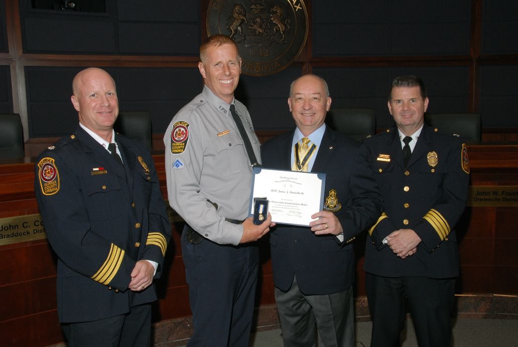 MPO James J. Banachoski receives the Law Enforcement Commendation Medal from President Phil Ray.