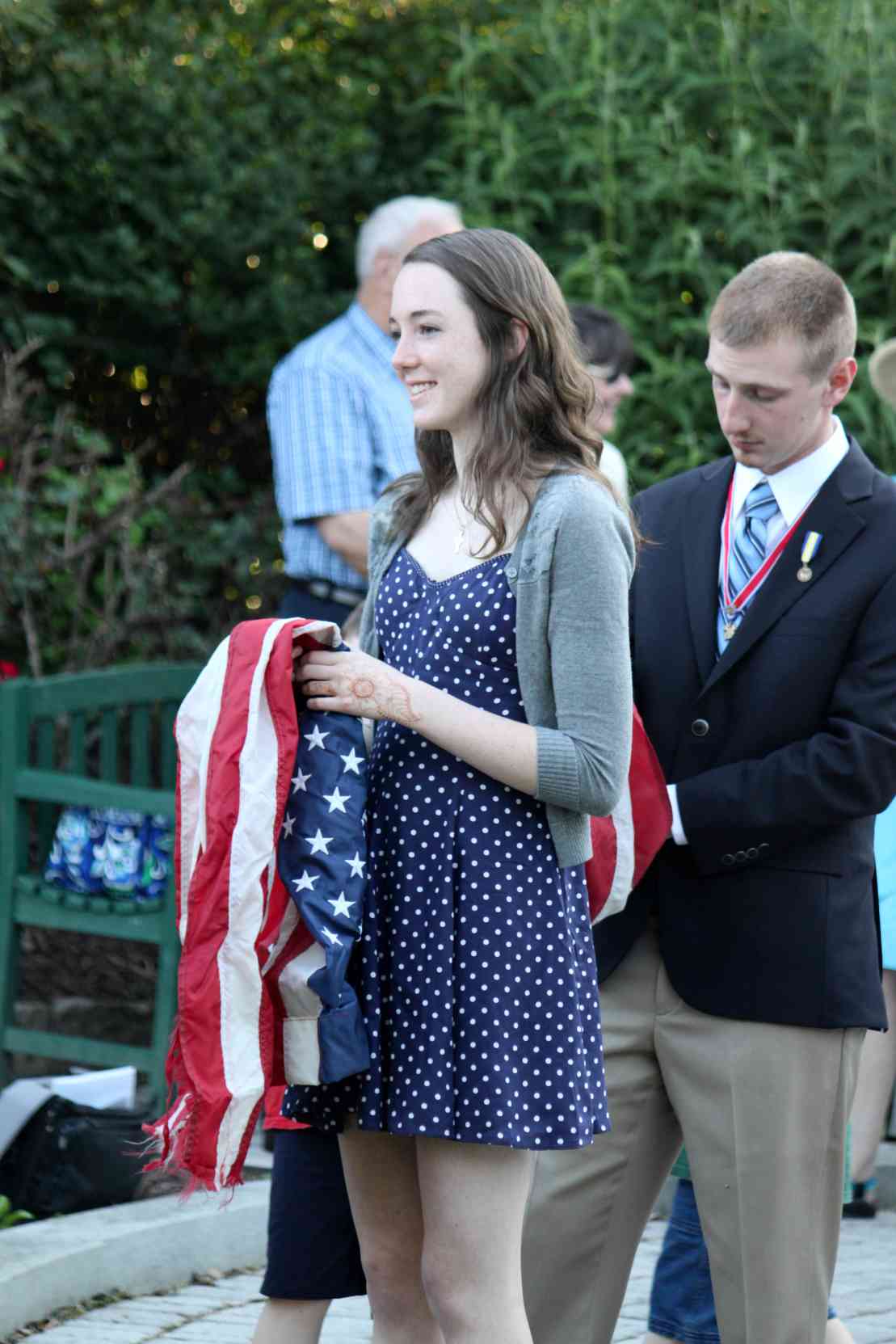 A C.A.R. member is ready to hand a worn flag to the firefighters assisting with the disposal process