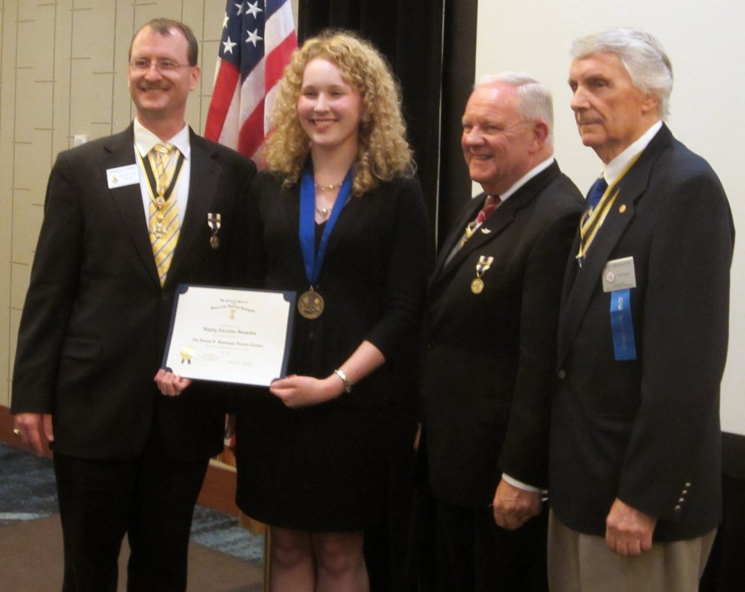 Hayley is awarded a medal and certificate as the 2014 oration winner. Also pictured (l-r): Darrin Schmidt, Larry McKinley, and VASSAR president Bill Broadus.