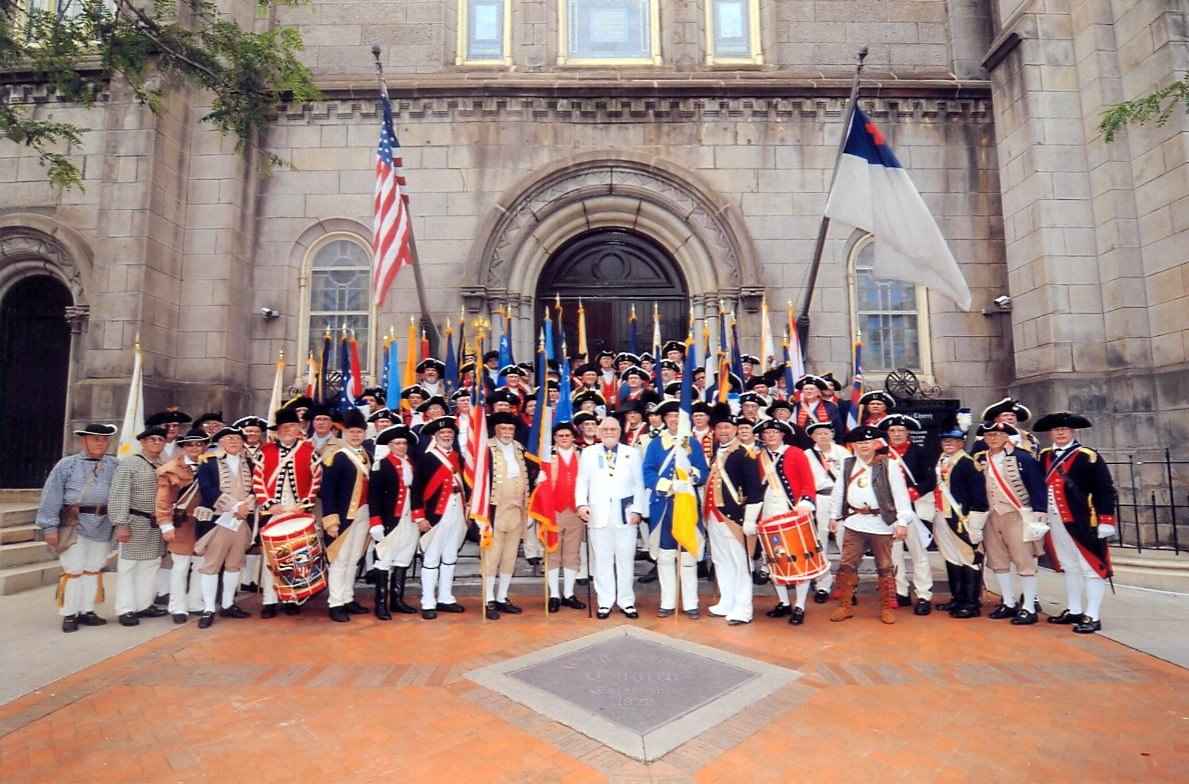 Colorguardsman Darrin Schmidt with the members of the national colorguard in front of the Old Stone Church after the Congress memorial ceremony in Cleveland, Ohio.