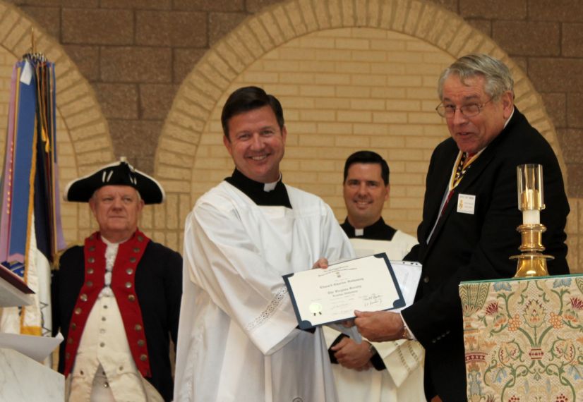 Father Hathaway receives congratulations from Chapter President Jack Sweeney