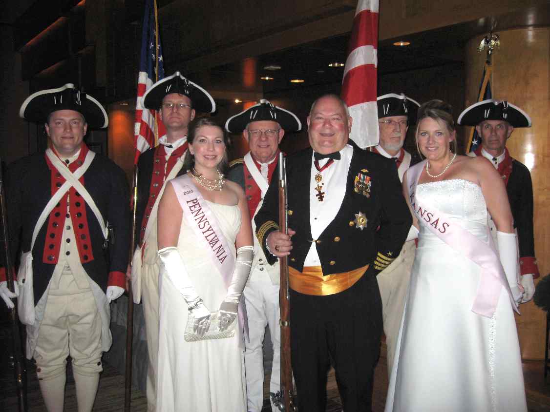 Members of the Fairfax Resolves and VASSAR Color Guard pose for a picture with (front line) Cherry Blossom Princesses Pennsylvania and Kansas as well as Kent Webber, SAR Compatriot and Festival coordinator. Colorguard members from left to right: Dan Rolph, Darrin Schmidt, Larry McKinley, Andy Johnson, and Peter Davenport.