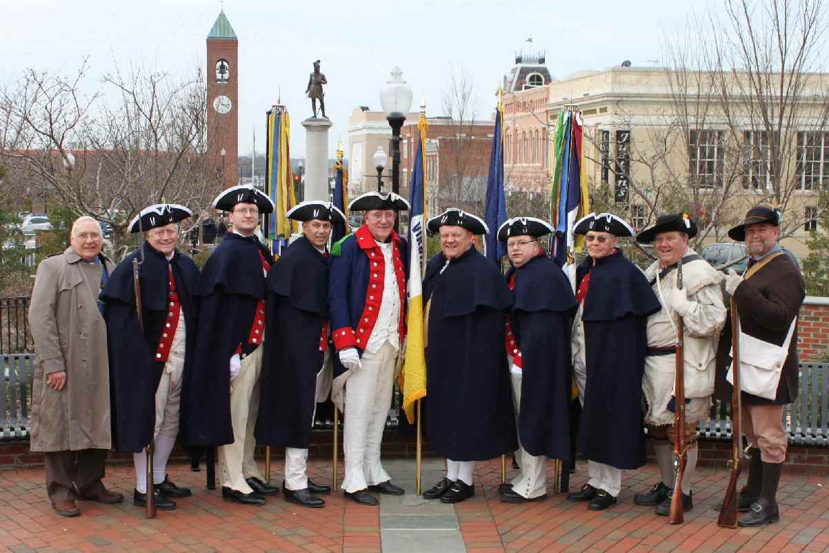 Members of the Fairfax Resolves and VASSAR Color Guard in front of the monument to Daniel Morgan.