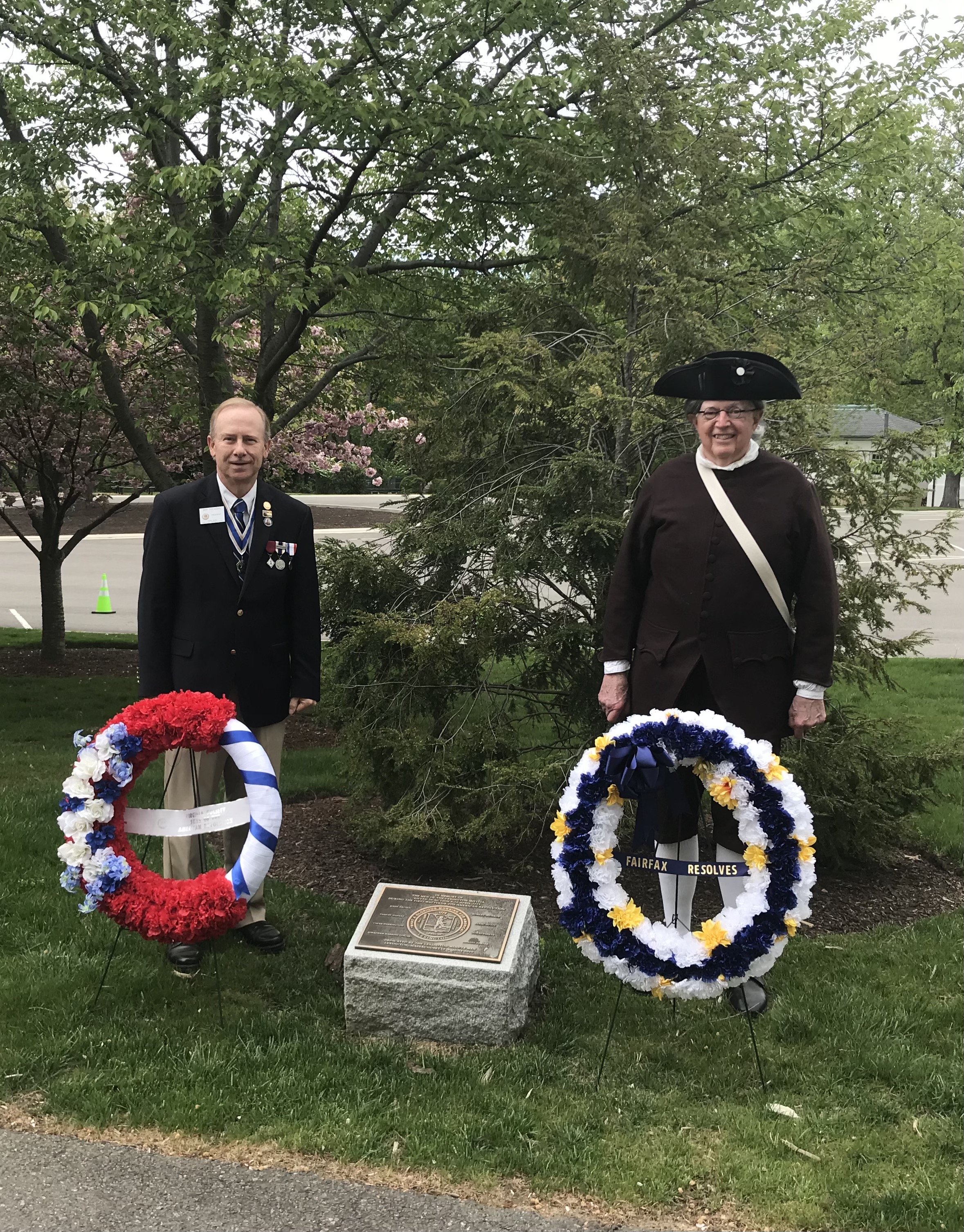 Compatriot Jeff Thomas, President, Virginia Society, Sons of the American Revolution, and Compatriot Dave Cook, President, Fairfax Resolves Chapter, present wreaths at the Lexington Minutemen Memorial at Arlington National Cemetery during the Patriots’ Day commemoration April 18.