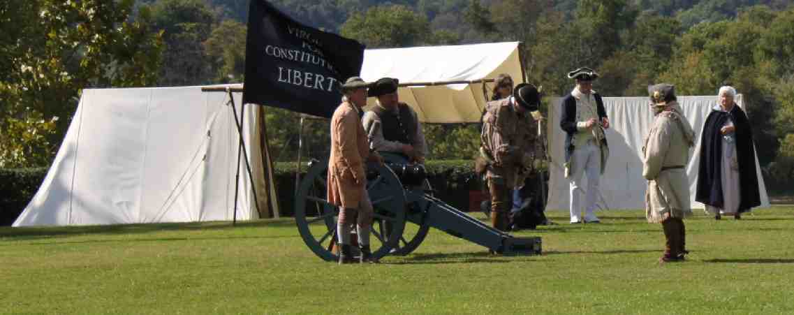 Reenactors prepare the cannon of for a salute during the annual Point Pleasant memorial ceremony