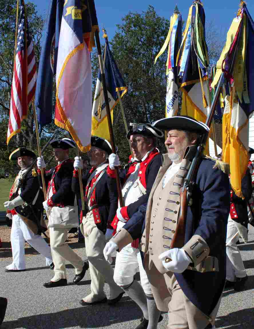 Members of the SAR carry the National and State Colors in the Yorktown Day Parade