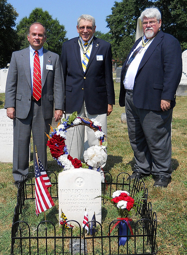 Fairfax Resolves members Bill Price and Jack Sweeney stand behind the Mountjoy Bayly grave marker with DC Society compatriot John Sinks.