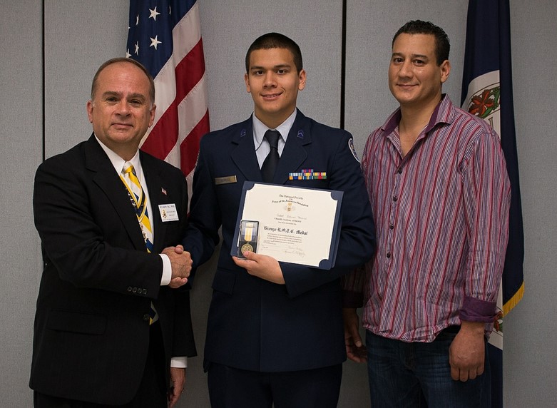 President Bill Price presenting the SAR JROTC Medal to Cadet Gabriel Berrios at Chantilly High School on 10 May, 2014.