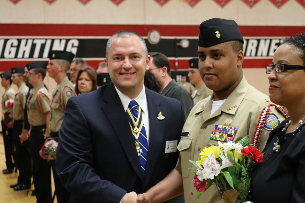 Compatriot Dan Rolph presenting the SAR JROTC Medal to Cadet Solomon at Herndon High School on 16 May, 2014.