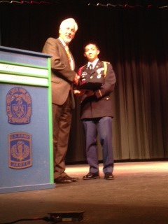 Compatriot Carl Loveland presenting the SAR JROTC Medal to Cadet Rulona at South Lakes High School on 14 May, 2014.