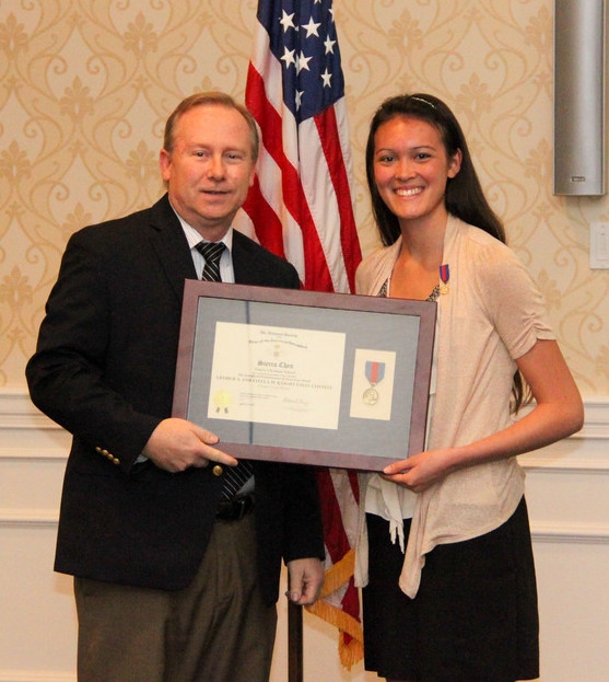 Essay chairman Jeff Thomas presents Miss Chen with a framed medal and certificate. A donation was made to the National Essay endowmnent in her name.