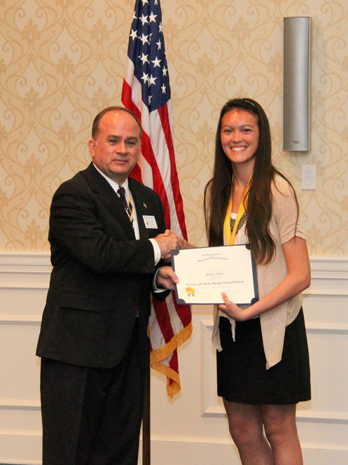 President Bill Price presents Miss Chen with a certificate and check for her state winning essay.