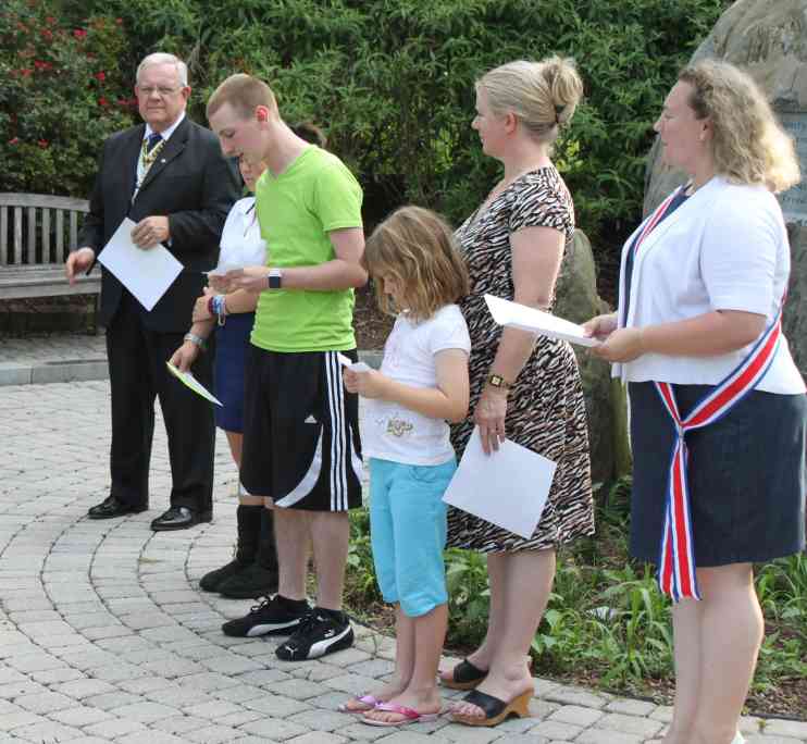 Attendees read their parts of the ceremony in honoring the history and tradition of the Flag and Flag Day.