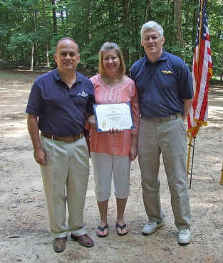 Compatriot Colgate Salomon (right) and his wife after being inducted by President Bill Price (left)