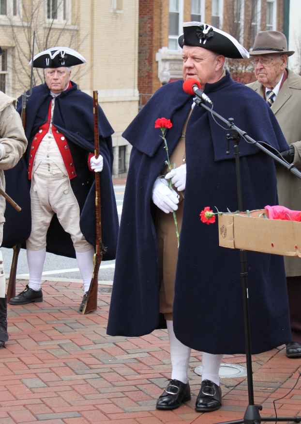 Larry McKinley carries a carnation for Virginia while Vern Eubanks stands at ease in the background.