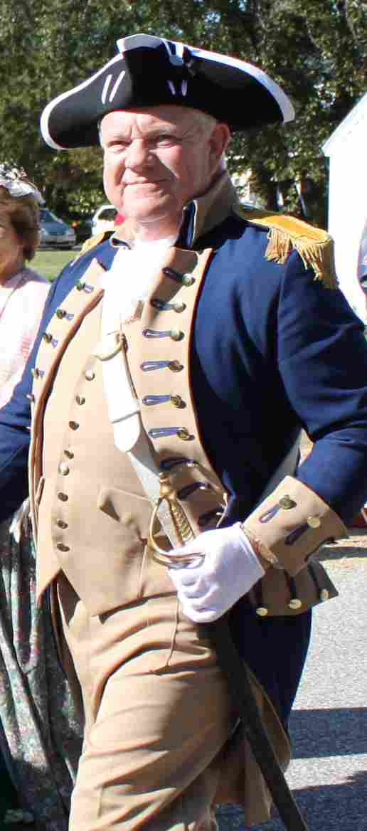 VASSAR Colorguard Commander and member of the Fairfax Resolves Chapter marching in the Yorktown Day Parade